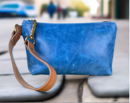 Small blue leather clutch bag made in the Midwest.