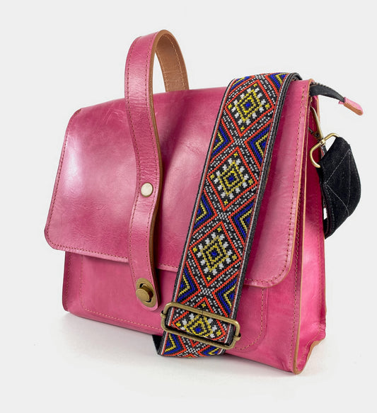 Leather Satchel style handbag handcrafted in the USA. Magenta pink features a colorful suede backed ribbon strap.