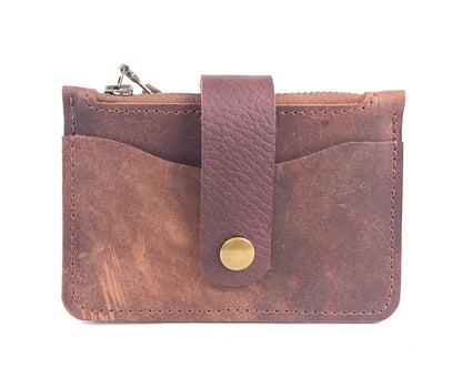 Rustic brown leather minimalist wallet for cards and cash with zippered pocket.