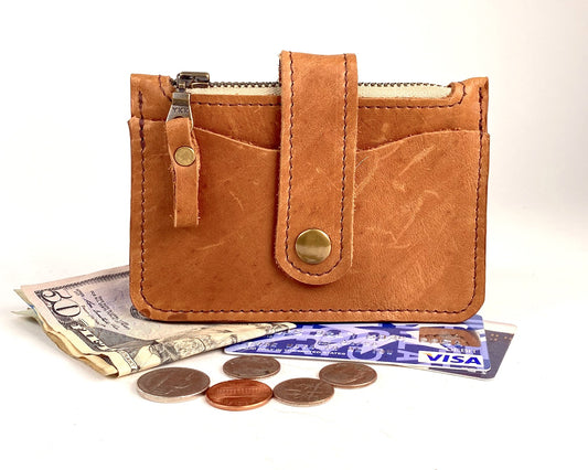 Tan leather wallet with card pockets and zippered pocket.